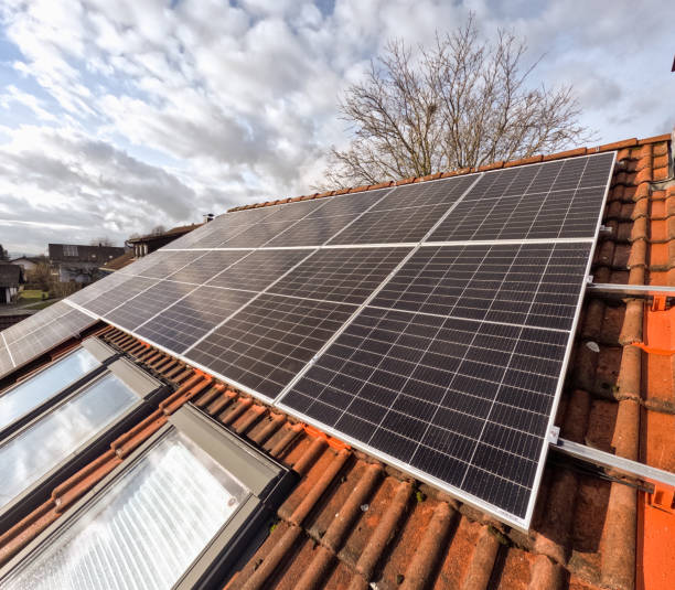 istock Solar panels on a roof with red tiles 2038224775