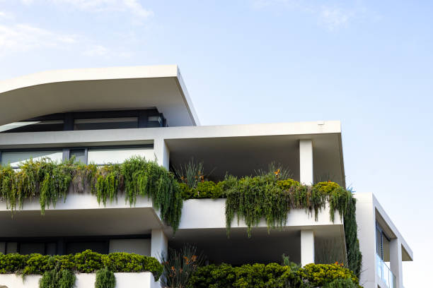 istock Closeup new, modern apartment building with vertical gardens, background with copy space 2038234520