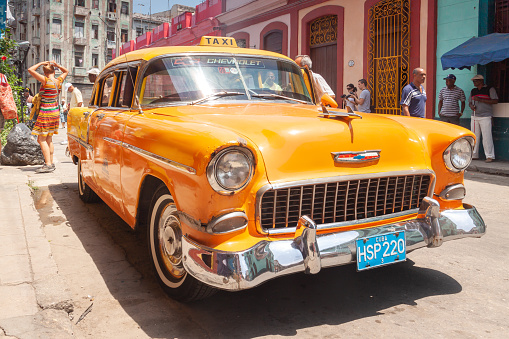 Havana, Cuba - April 11, 2010: A vintage yellow taxi, a Chevrolet classic american car parked in Havana, Cuba