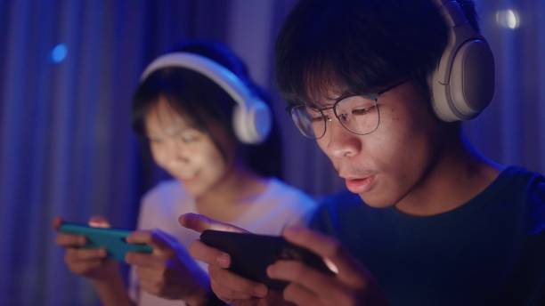 istock Two teenage having fun with game on smartphone. 2038295442