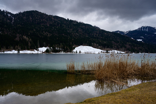 On of Seven Triglav's lakes and mountain hut on sunny day. Julian Alps, Slovenia