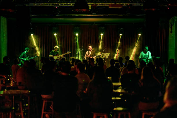 istock Music Band Performing on, stage light and smoke effects. 2038327791