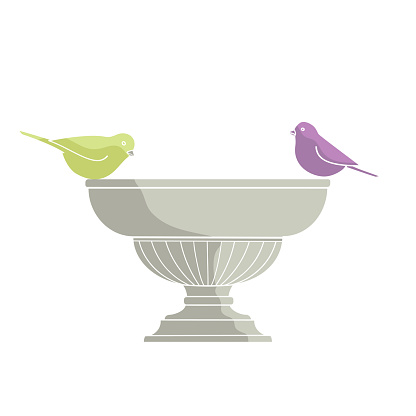 birds are sitting on a garden vase