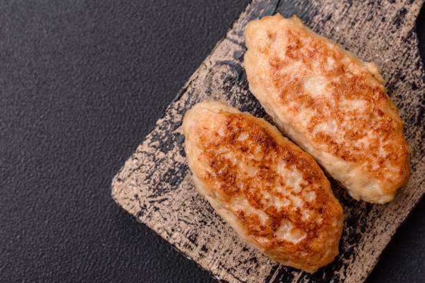 istock Delicious fresh fried minced fish cutlets with spices and herbs 2038344256