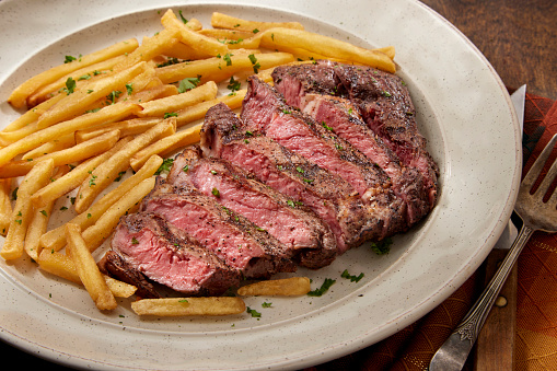 Steak Frites - Medium Rare Strip Loin Steak with Shoe String French Fries