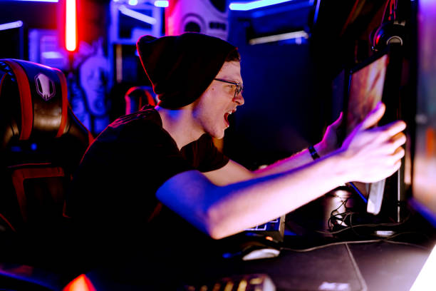 istock Young man's passion for gaming shines 2038394478