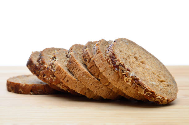 Slices of fresh bread, bakery products, pastries close-up.