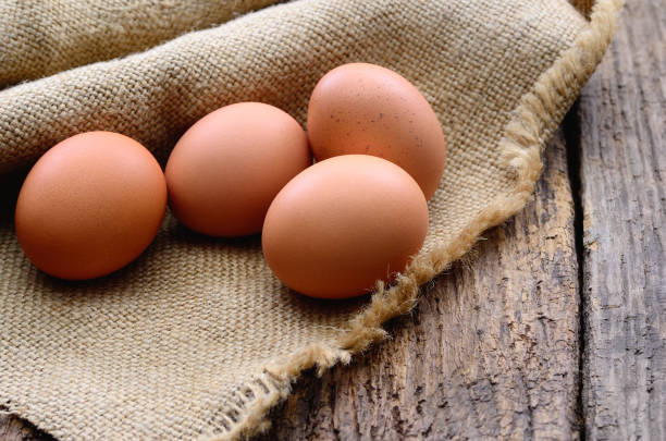 istock Fresh chicken eggs on the table. Animal products 2038395534