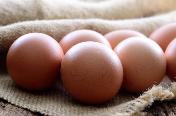 Fresh chicken eggs on the table. Animal products.