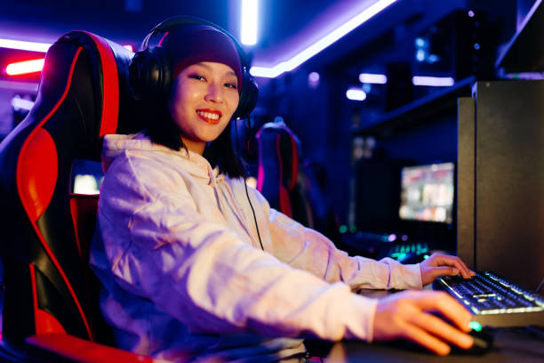 istock Game room lights up with woman's skill 2038396608