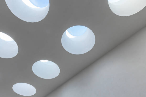 Round ceiling skylight portals with blue sky behind in a white room, abstract minimal architecture background photo