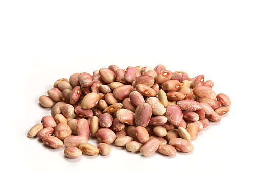 Pile of raw kidney beans, pinto beans isolated on white background, healthy food concept