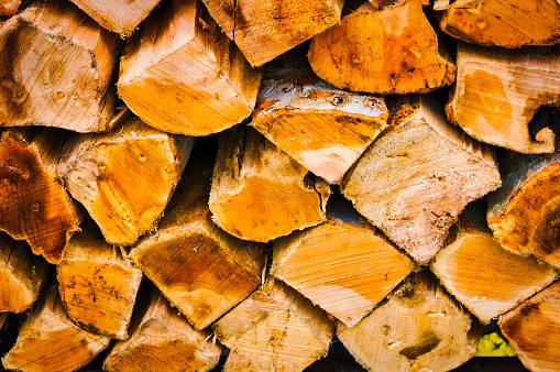 A stack of firewood, split, dried and ready for burning.
