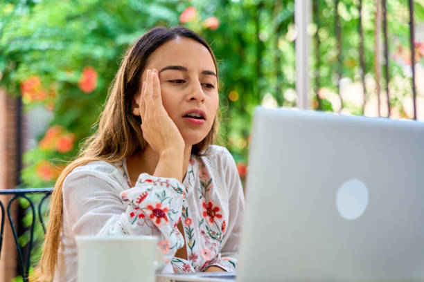 istock woman with her laptop computer looking worriedly 2038511961