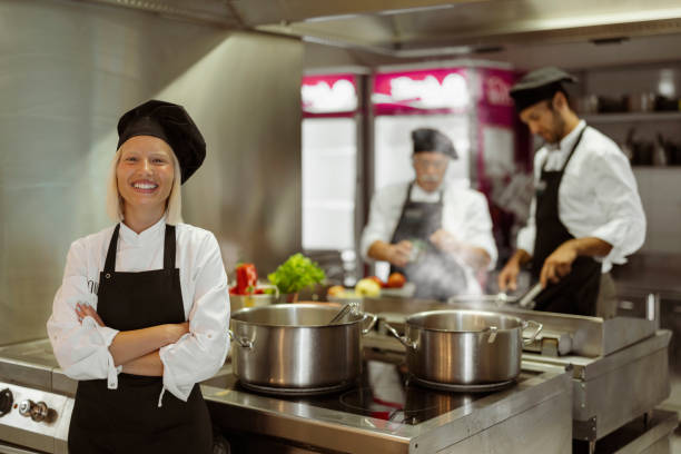 istock Head Female Chef Looking at Camera in a Modern Professional Kitchen 2038547314