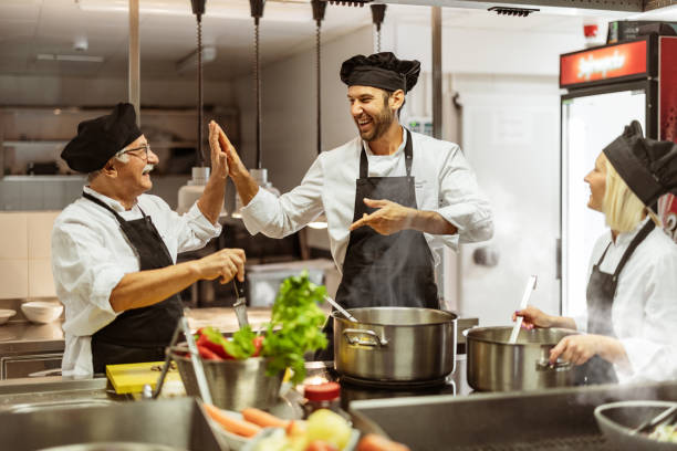 istock Giving Five and Cheering in a Commercial Kitchen 2038551002
