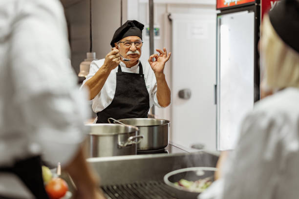 istock Senior Male Chef in a Modern Professional Kitchen 2038551006