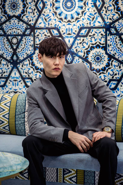 istock Asian handsome man sits in luxury interior, fashion 2038552563