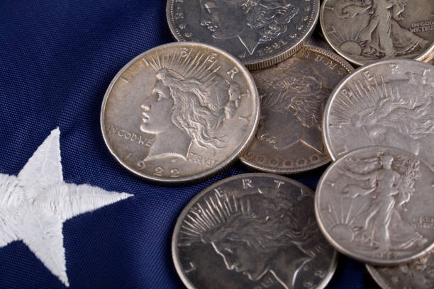 istock United States old silver coins on US Flag 2038587299