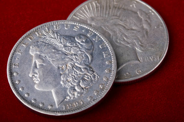 istock United States Silver dollars on red background 2038589738