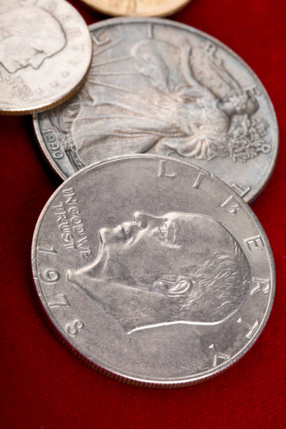 Different types of U.S. silver dollar coins background.
