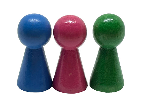 Three wooden colored board game chips. Color chips for board games on a white background