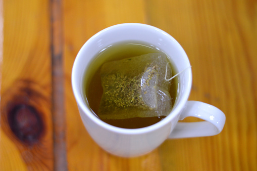 Anise hot drink, with so many healthy benefits, anise packet in a boiled hot water to prepare the drink, Aniseed Pimpinella anisum is a flowering plant in the family Apiaceae, selective focus