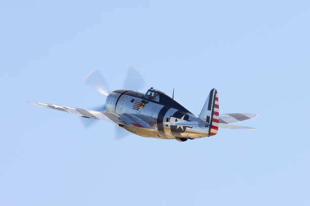 istock Tail view of a P-47G Thunderbolt (WWII American fighter plane)  with its “Invasion Stripes”, in epic light 2038914074