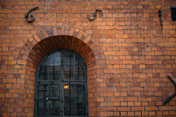 istock Full frame shot of a brick wall with a window 2038916688