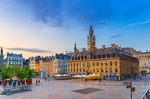Lille cityscape, La Grand Place square in city center, historical monument Flemish mannerist architecture style buildings, Old Stock Exchange and bell tower Chamber of Commerce, Northern France