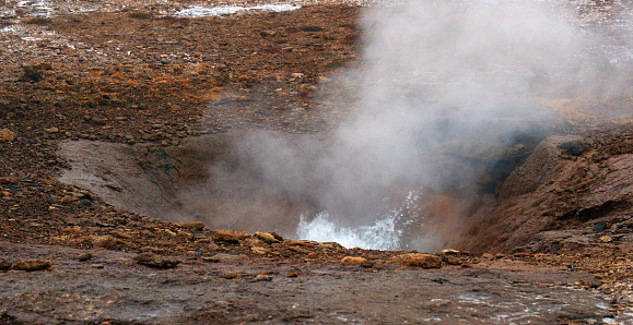 Boiling geothermal pools in Iceland's Geothermal Valley, a stop on the Golden Circle Route.