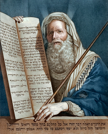 Vintage image features Moses and the Ten Commandments. Moses is typically depicted as an elderly figure with a flowing beard and robes, often wearing a prayer shawl (tallit) to symbolize his devotion and spiritual leadership. The stone tablets he received from God on Mount Sinai bear inscriptions in Hebrew. These portrayals emphasize Moses' pivotal role as a conduit between God and the Israelites, serving as enduring visual reminders of the foundational laws that shape Judeo-Christian ethics.