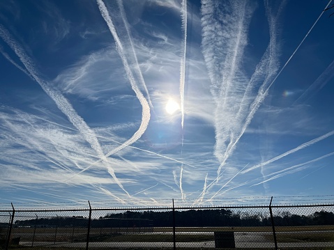 Norfolk, VA,USA: A tangled web of contrails in the sky over Norfolk Airport.