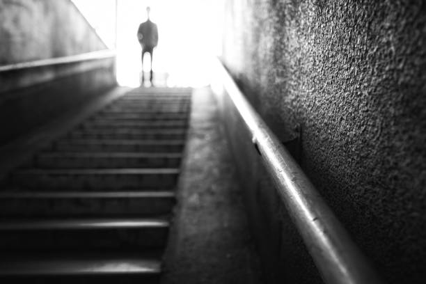 istock Blurry image of a person coming down the stairs 2038979802