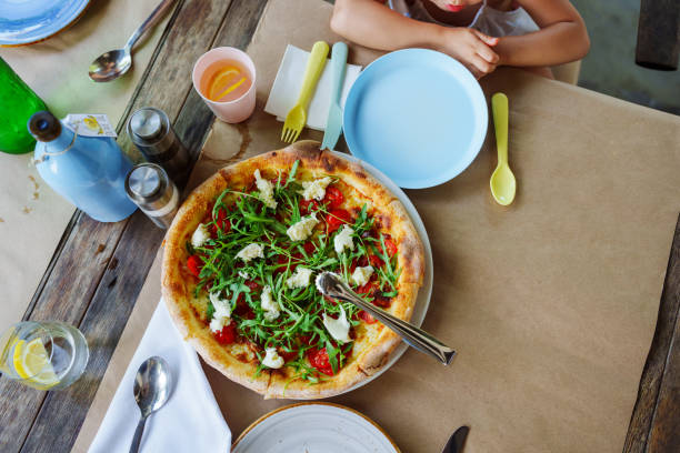Aerial view of a pizza on a restaurant table