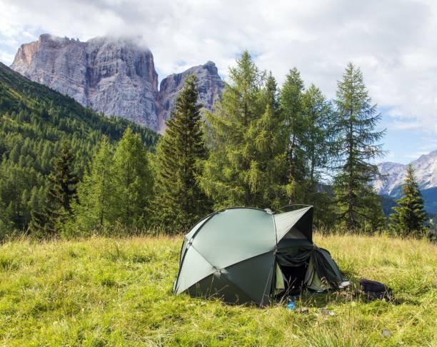 istock green hiking tent and Alps Dolomites mountains 2039081039