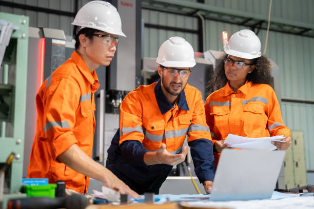istock Multiracial engineer team collaborates in a factory brainstorm, uniting diverse skills for innovative solutions. 2039097337