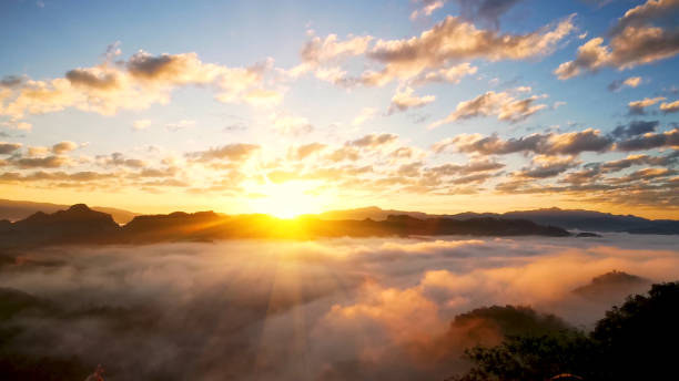 istock Scenic view dramatic beautiful sunset sky. Natural Sunset Sunrise on meadow silhouette shadow dark land. Vibrant dramatic sky on sunset, dawn, sunrise in Countryside. Landscape Colorful Sky At Sunset 2039103945