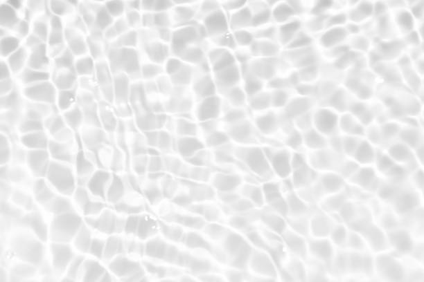 istock White water surface texture with ripples, splashes, and bubbles. Abstract summer banner background Water waves in sunlight with copy space cosmetic moisturizer micellar toner emulsion. White water. 2039226259