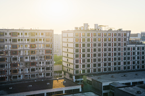 Sunrise sunlight shines on urban residential buildings