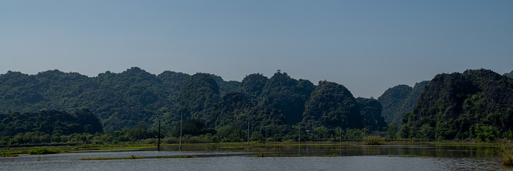 Views of green mountains, blue skies, rice fields in Vietnam in November.