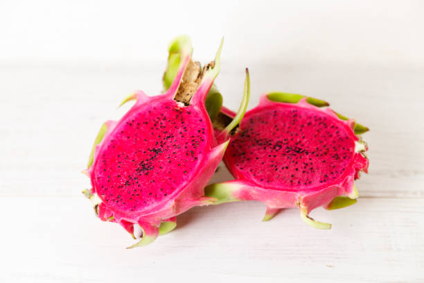 red dragon fruit on white wooden background. - 7646 뉴스 사진 이미지