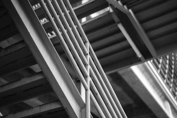 Metal overpass platform with banister structure of the factory place. Industrial building part. Close-up and selective focus.
