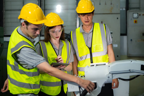 istock Engineer and technician discussing the robotic arm in factory about work operating, maintenance and repair 2039431299