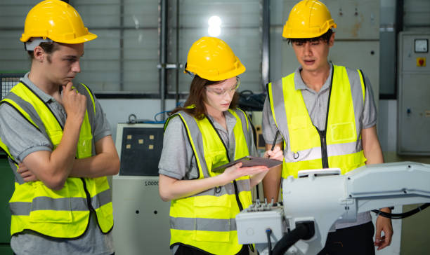 istock Engineer and technician discussing the robotic arm in factory about work operating, maintenance and repair 2039431304