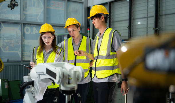 istock Engineer and technician discussing the robotic arm in factory about work operating, maintenance and repair 2039431827