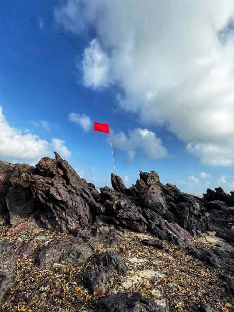 istock dangerous -red flag on tanjung balau beach. 2039436586