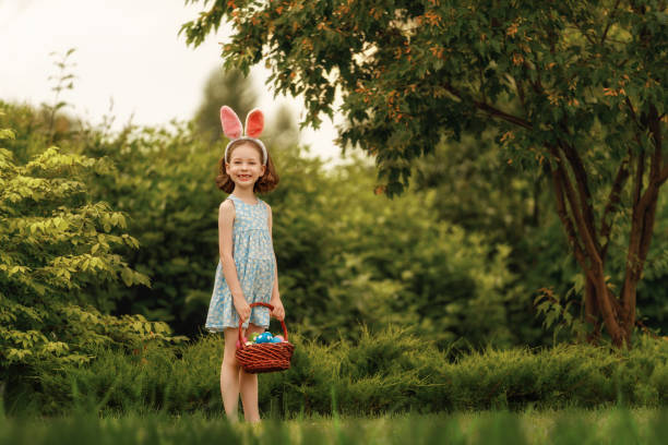istock child with painting eggs outdoors 2039448095