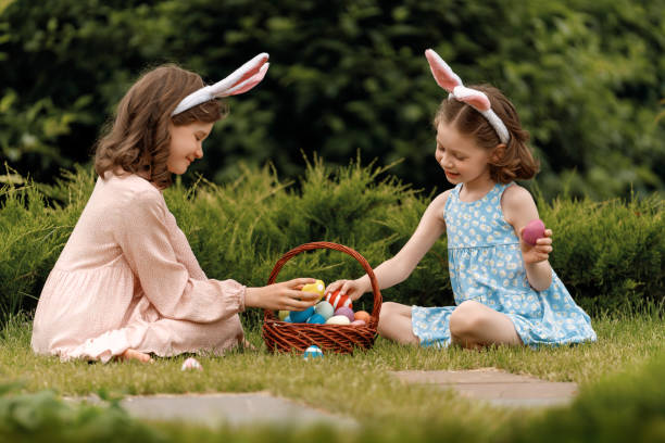 istock children with painting eggs outdoors 2039448103