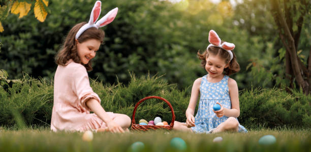 istock children with painting eggs outdoors 2039448104